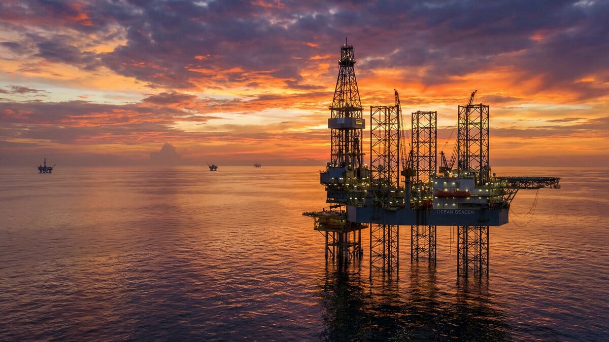 Oil drilling platform at sunset