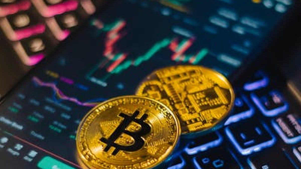 Bitcoin and Ethereum cryptocurrency coins on trading chart display