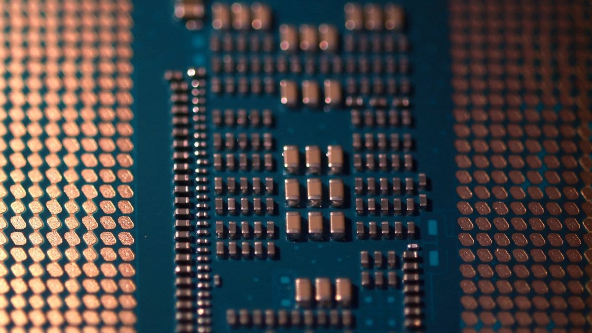 Close-up of semiconductor chip circuitry representing the AI-driven memory chip boom powering the Micron Technology rally and broader tech sector gains