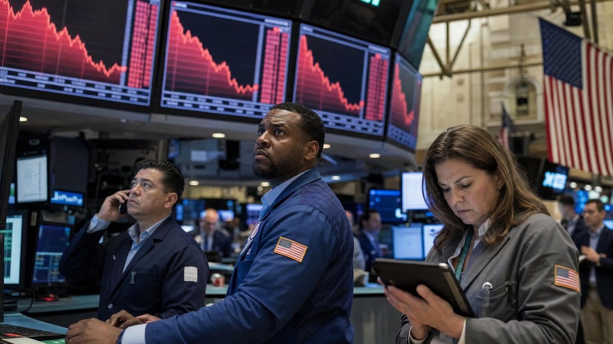 Traders on the floor of the New York Stock Exchange looking concerned at screens displaying declining red market charts