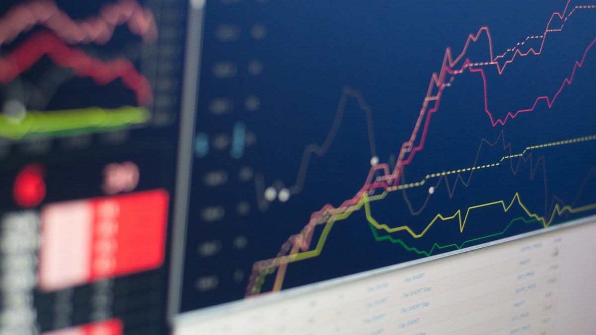 Stock market trading charts showing earnings season performance data