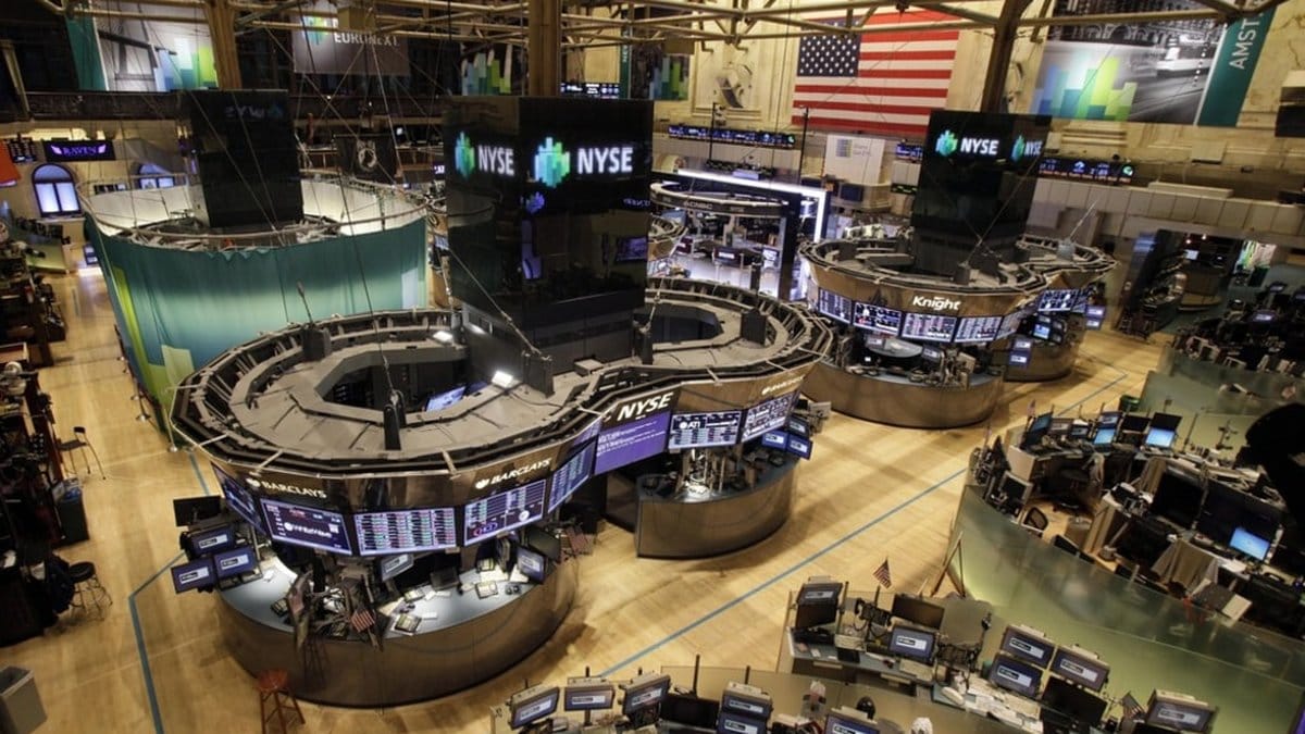 NYSE trading floor with market data screens and financial activity during active trading session