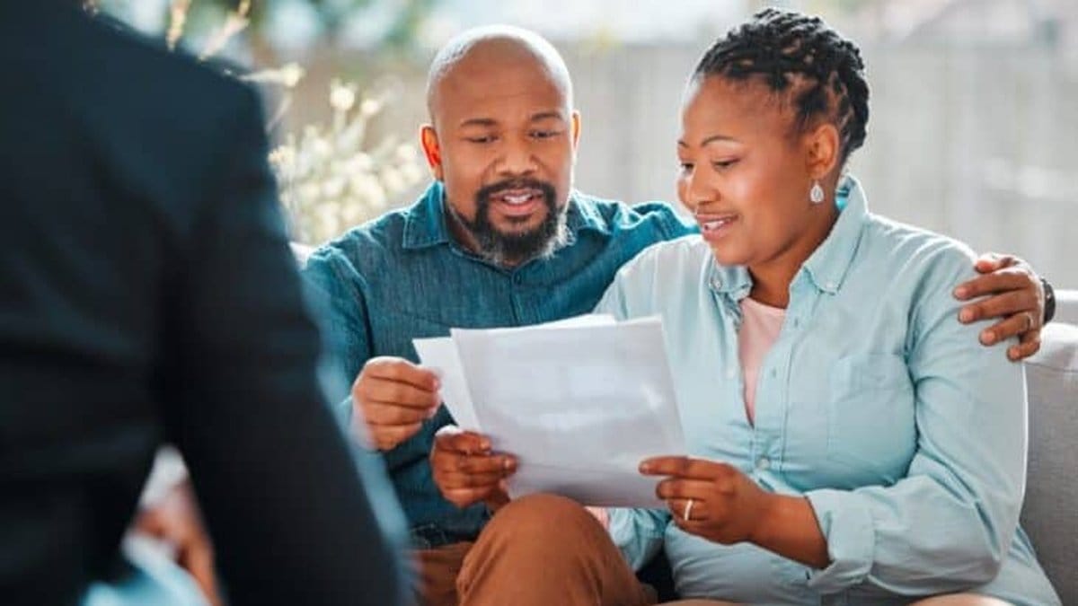 Diverse couple meeting with a financial advisor to discuss retirement planning