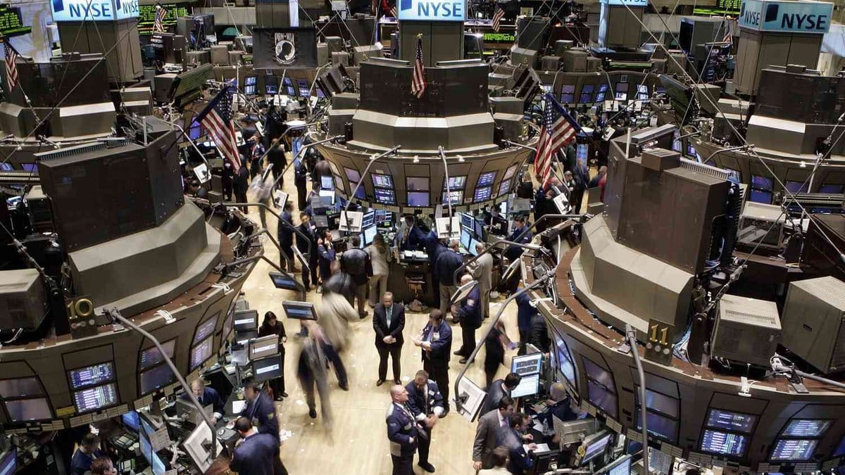 Traders work on the floor of the New York Stock Exchange as markets experience tech sector sell-off on June 24, 2026