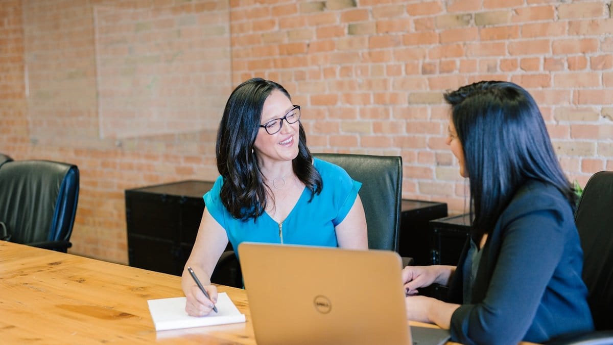 Female financial advisor meeting with a client discussing retirement planning