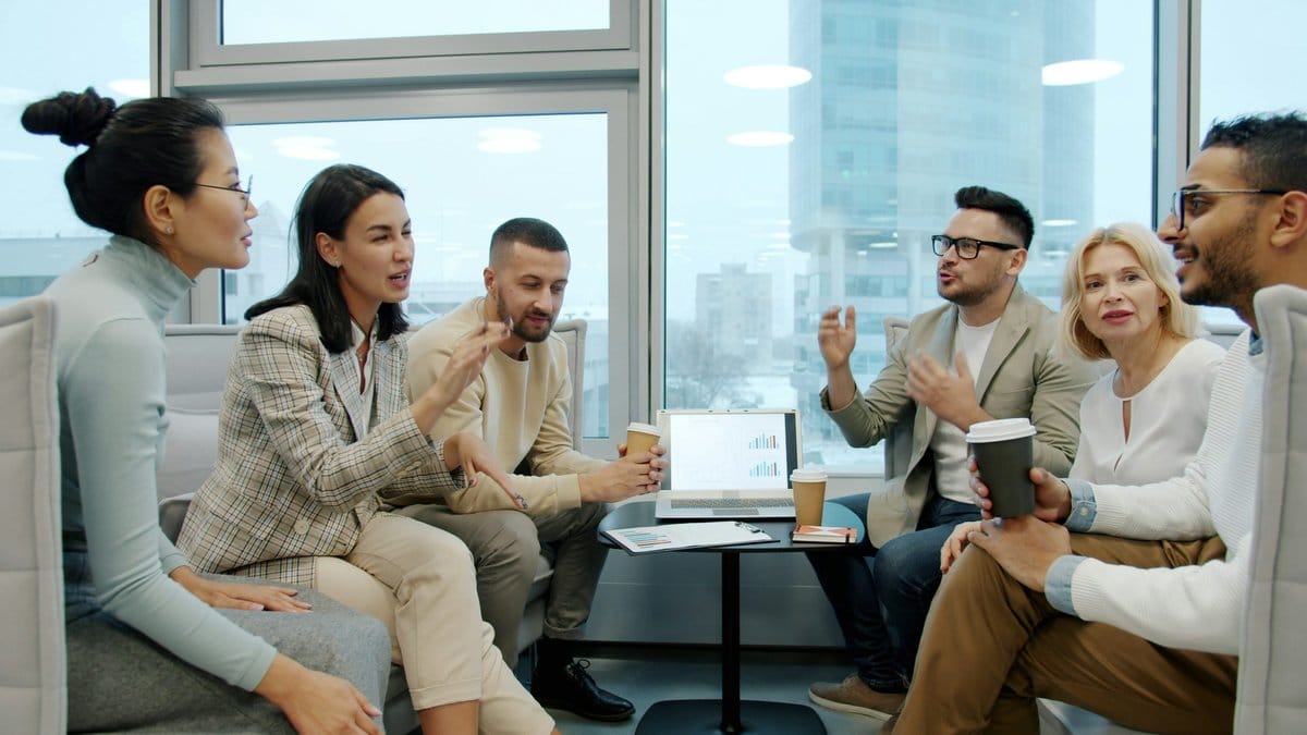 A diverse group of financial professionals reviewing corporate earnings results in a modern office