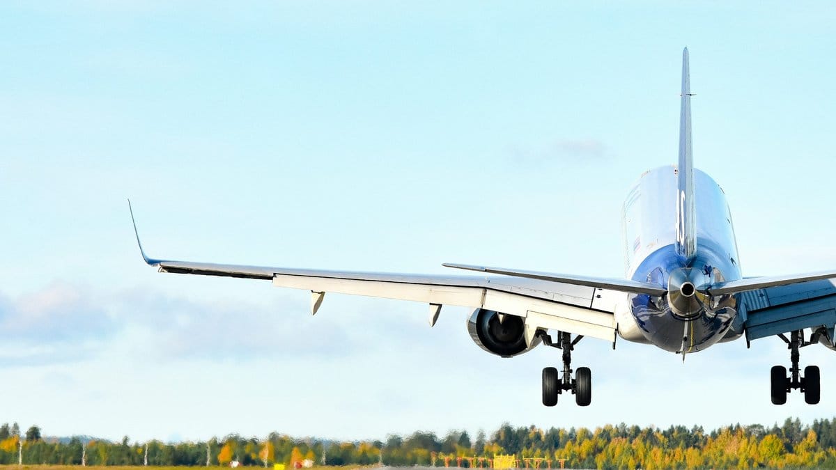 Commercial passenger aircraft approaching an airport runway