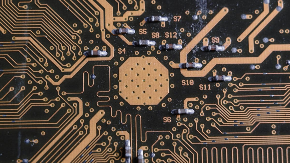Detailed close-up of a semiconductor circuit board highlighting electronic pathways