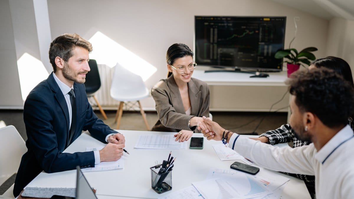 Diverse business team discussing financial documents during an office meeting
