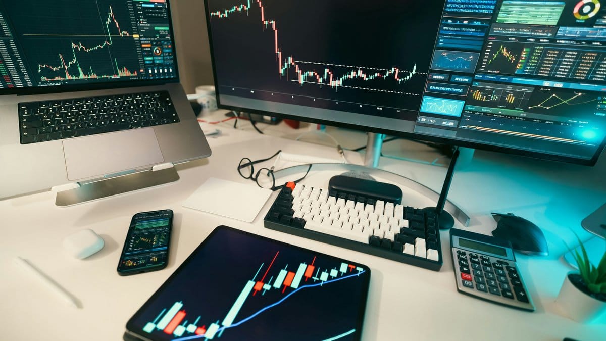 A financial workstation displaying multiple stock market charts and rate-sensitive market data