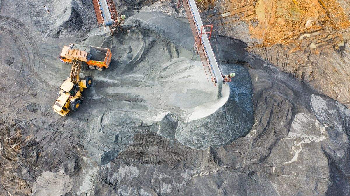 Aerial view of open pit mining operations — a key source of precious metals supply