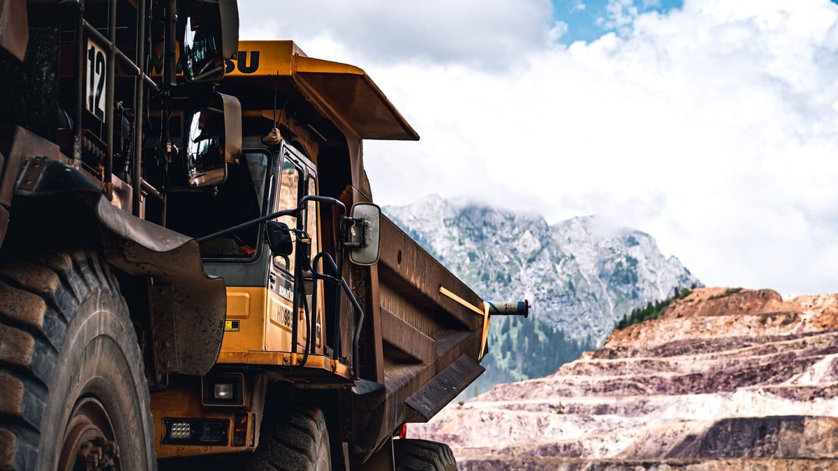 Large haul truck operating at an open-pit mining site