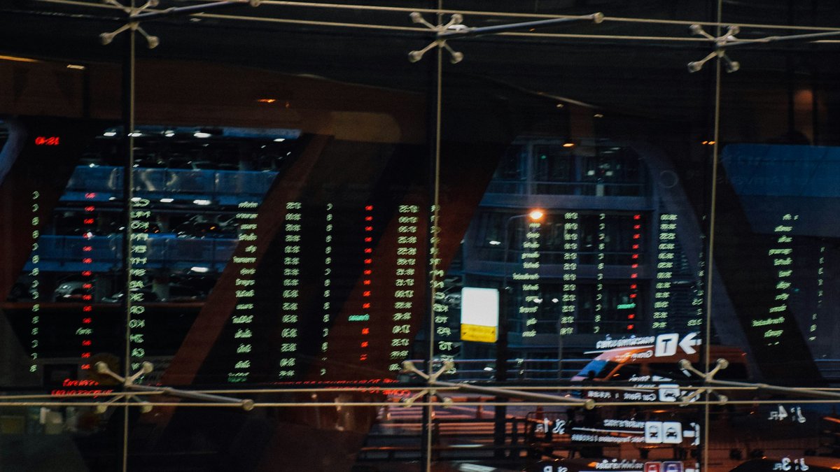 Trading floor market boards reflecting global market volatility