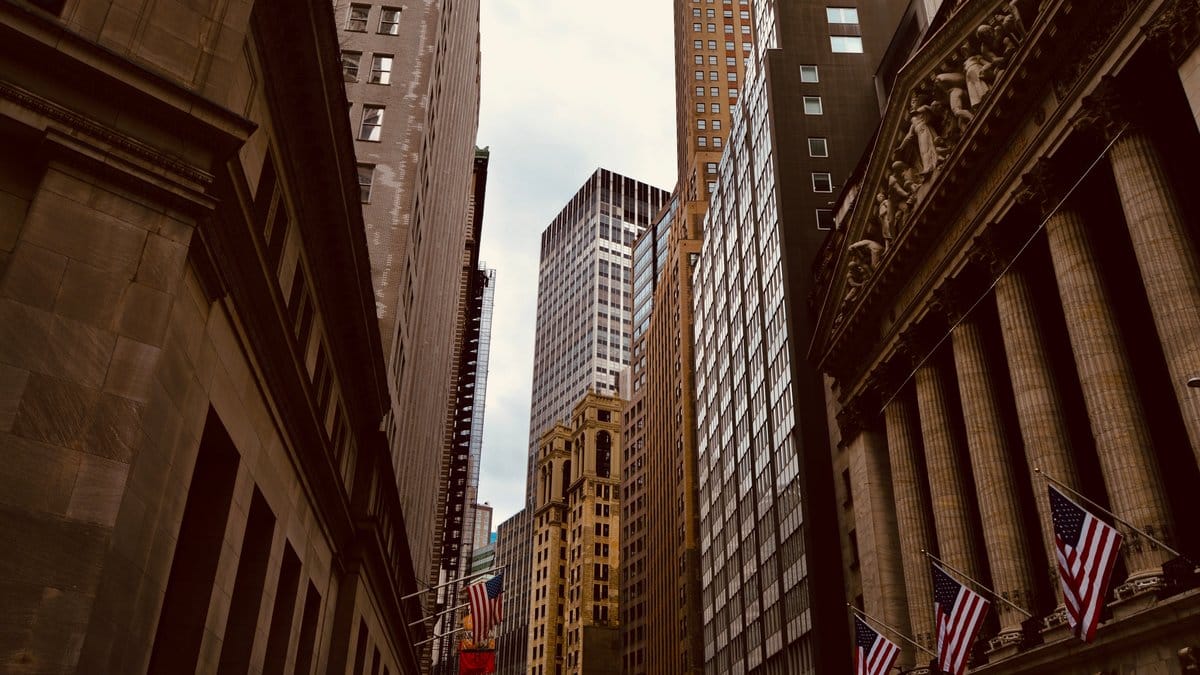 Wall Street financial district buildings representing daily U.S. market conditions and investor sentiment