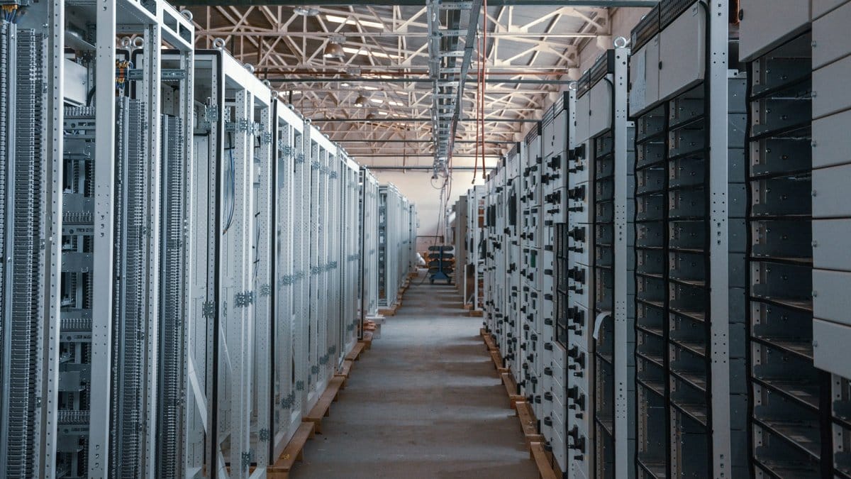 Data-center equipment corridor illustrating AI infrastructure demand