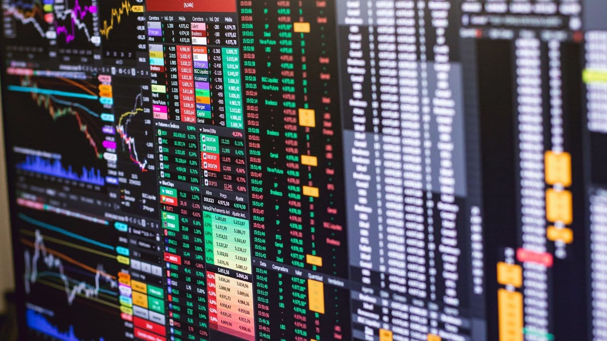Close-up of financial market data screens in a trading environment
