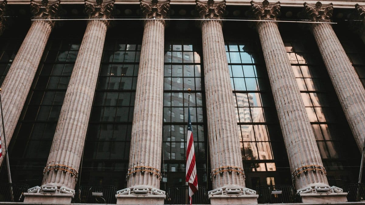 New York Stock Exchange columns representing Wall Street market trading and U.S. equity outlook