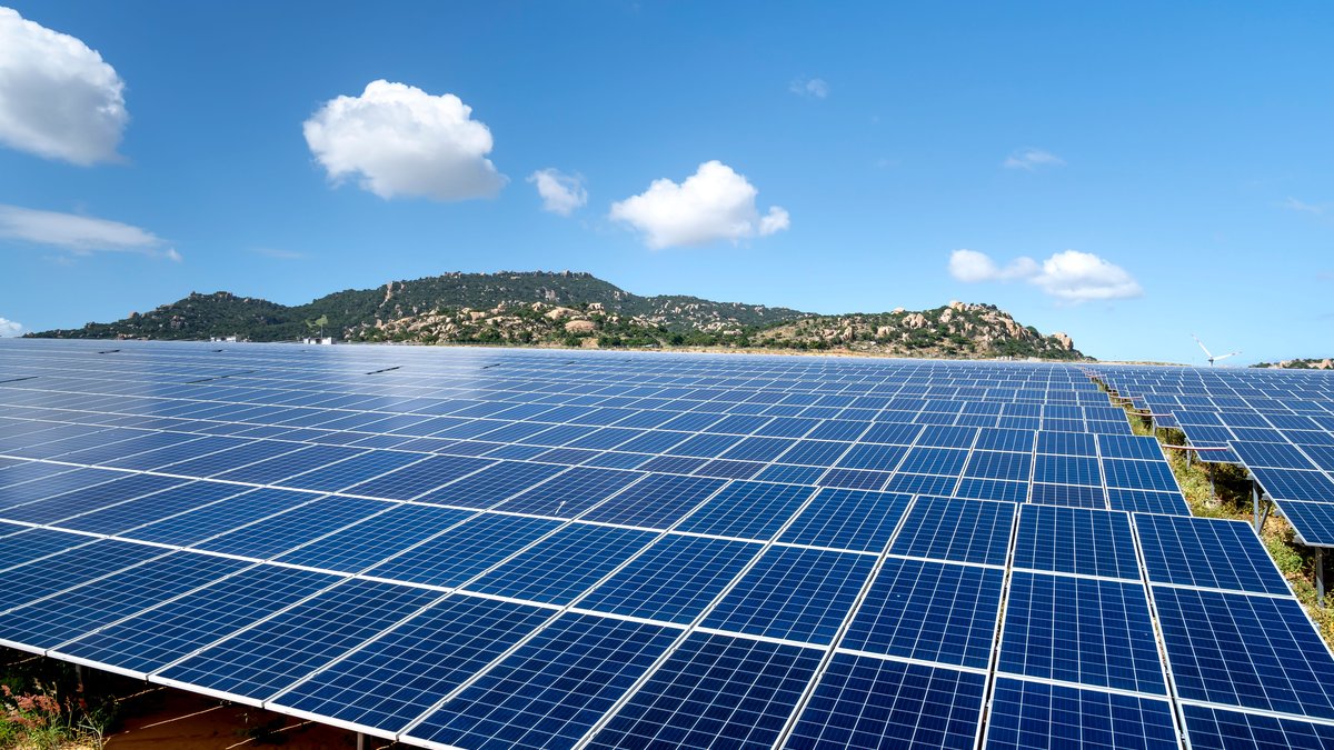 Rows of solar panels illustrating photovoltaic silver demand and the industry's efforts to reduce silver use per cell